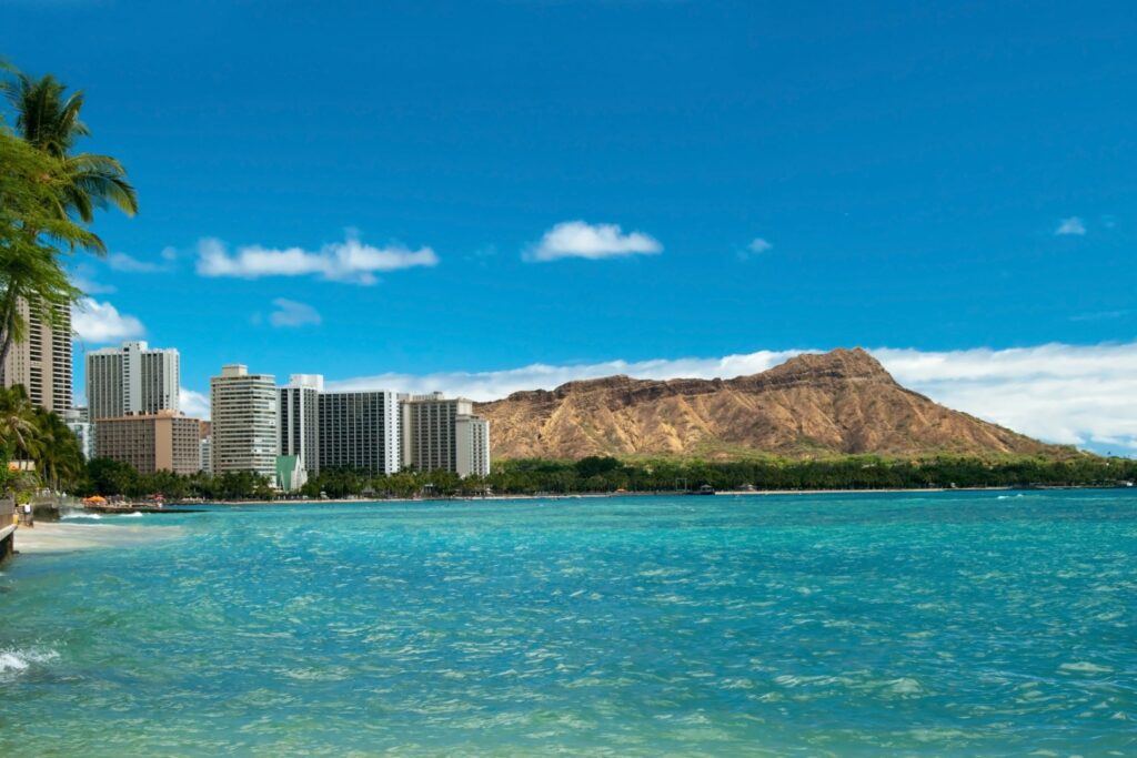 Waikiki Beach With Azure Water In Hawaii With Diamond Head In Ba